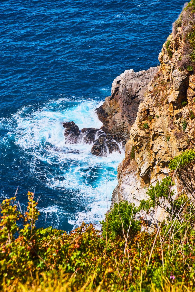 Detail of waves crashing into rocks